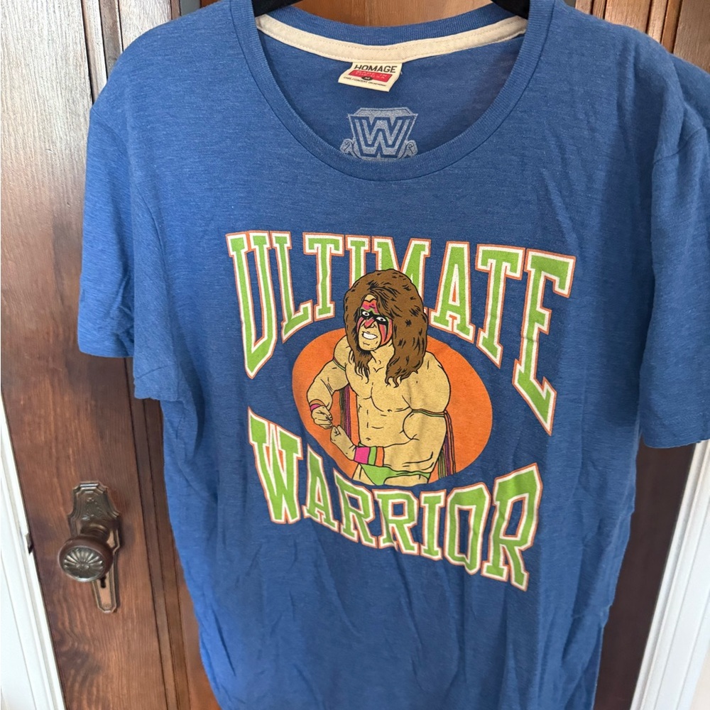 HOMAGE Blue Ultimate Warrior Graphic Tee with Orange and Green Accents